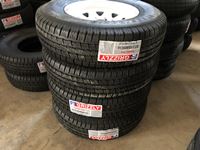    (4) Grizzly Trailer Tires on (8) Hole  Rims