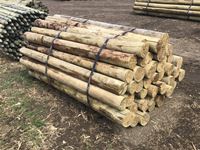    (50) 5-6 In. x 7 Ft Treated Blunt Poles