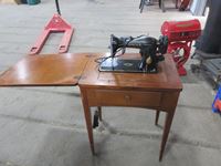    Singer Electric Sewing Machine with Cabinet