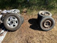    (4) Tires P175/65R14 and Steel Rims and (2) Tires 215/70R14 Tires with Aluminum Rims