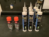    (9) Tubes of Cover Base Adhesive & (2) New Cans of Fluorescent Paint