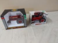 (2) 1 /16 Scale International Tractors in Boxes