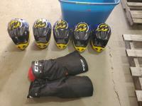 (5) Bike Helmets and Pair of Kids CCM Hockey Pants