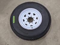 Grizzly 235/85R16 Tire on 8 Bolt Rim