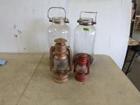 (2) 4 Gallon Jugs, (2) Kerosene Lamps and Wooden Crate