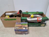 (2) Boxes of Muffler Pipes Various Lengths Mostly 4 Inch and (1) Elastomer Springs (unused) 