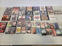 Assorted CDs, Cassettes Videos, Tapes, Books, Olympus 35 mm Camera