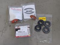 (2) Sidewall Slugs, (4) Oil Seal Assemblies and (1) Caliper Rebuild Kit