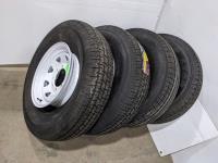 (4) Grizzly 235/85R16 Tires On 8 Bolt Rims