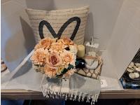 Cushion, Floral Arrangement and Turkish Towel