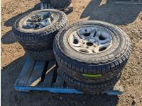 (4) Ridgetrak Rovelo 235/75R15 Tires On 5 Bolt Rims with Caps