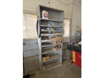 Metal Shelf Unit with Wheel Weights and Tire Changing Items